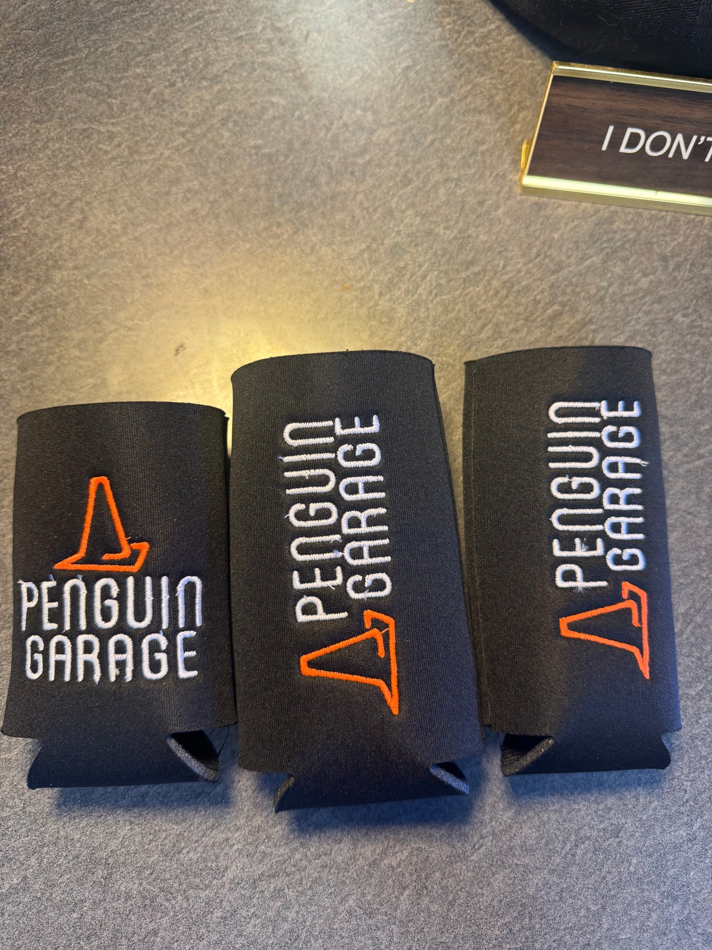 Penguin Garage Can Koozies